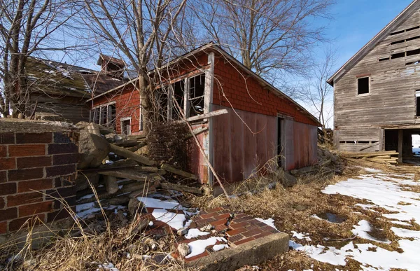 Old farmhouse and barn in the rural Midwest.