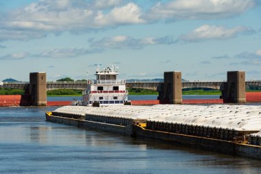 Barge on the Mississippi River on a beautiful Summer morning.  Bellevue, Iowa, USA clipart
