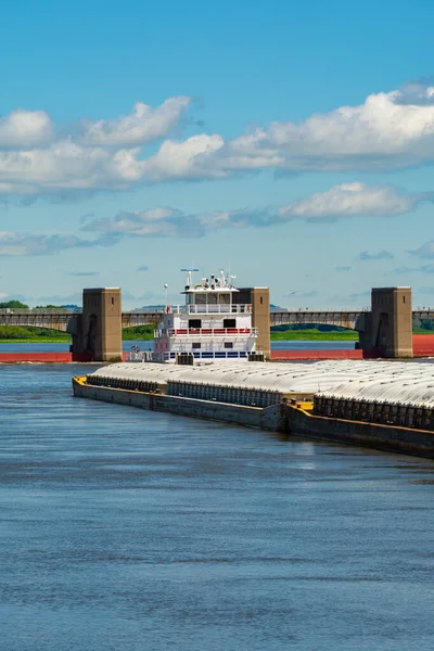 Barge on the Mississippi River on a beautiful Summer morning.  Bellevue, Iowa, USA