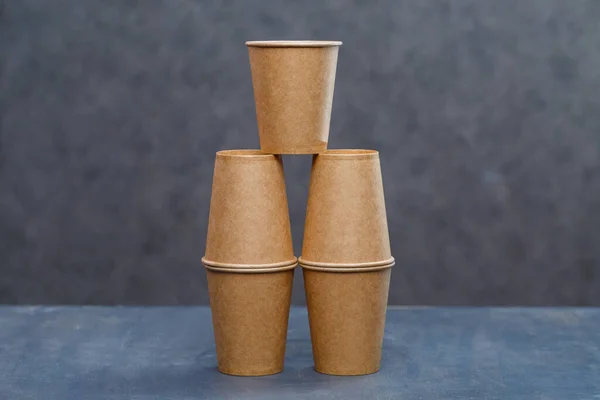 Paper cups for drinking, dishes. Disposable cardboard dishes made from environmentally friendly materials. Doesn\'t clog nature Eco-friendly, disposable, reusable, compostable dishes.