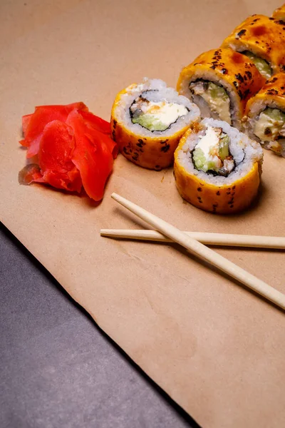 A set of sushi from many types of roles and with different stuffing. Sushi menu. Japanese gourmet sushi.