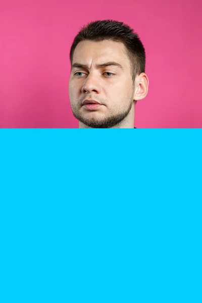 Young Handsome Man Holding Blank Cardboard Blue Banner Isolated Pink — Stock Photo, Image