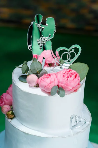 Big sweet wedding cake for newlyweds