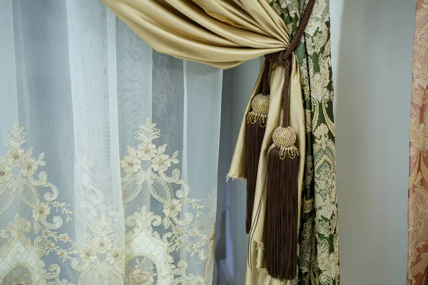 Close up of a curtain. part of the drapery by the window. Tulle for windows