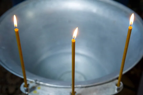 Water is poured into the font for bathing the baby in the church, religious traditions