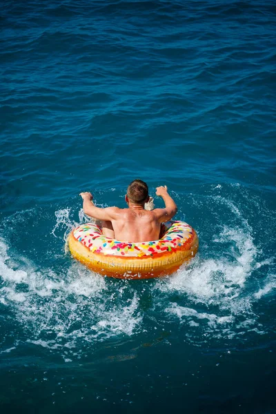 Young Man Floats Inflatable Air Ring Circle Sea Blue Water — Stock Photo, Image