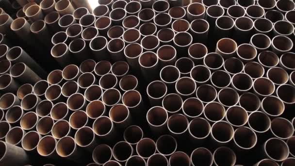 Large pile of steel pipes used for wells with water. — 图库视频影像