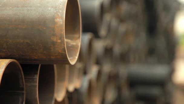 Large pile of steel pipes used for wells with water.Close-up. — Stock Video