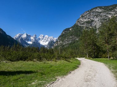 Trekking trail in the dolomites area clipart