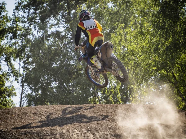 Motocross rider on a trail during a training — Stock Photo, Image