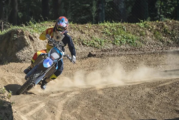 Motocross rider on a trail during a training — Stock Photo, Image