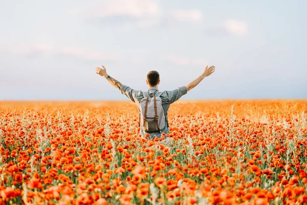 Happy Traveler Man Backpack Standing Hands Red Poppies Flowers Meadow — Stock Photo, Image