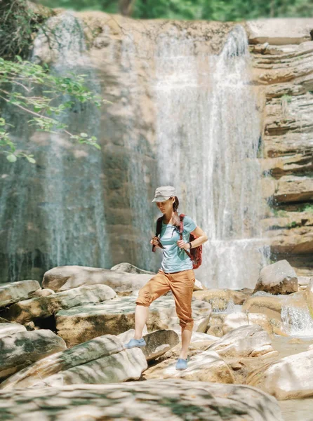 Explorer Backpacker Young Woman Walking Stones Front Waterfall Outdoor Sunny — Stock Photo, Image