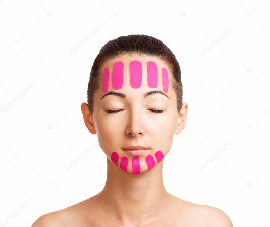 Beautiful woman with kinesiology facelift tapes.