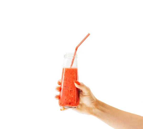 Female hand holding bottle of berry smoothie. — Stock Photo, Image