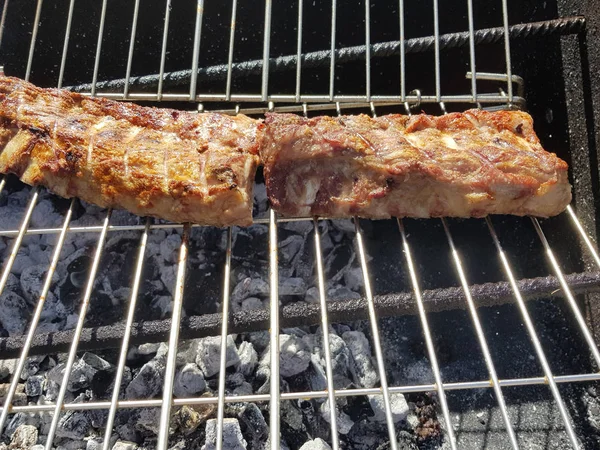 Beef and cow steak grilled next to chorizo for grilling — Stock Photo, Image