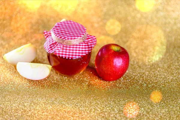 Мед і яблука над боке золотим тлом . — стокове фото