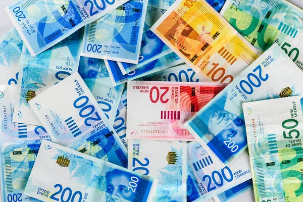 NIS Yığını - Yeni İsrail Shekels banknotları yeni 200, 100, 20, 50 sheqel ile. Şekel banknotların duvar kağıdı - Top View. İsrail 'in siyaseti ve parası.