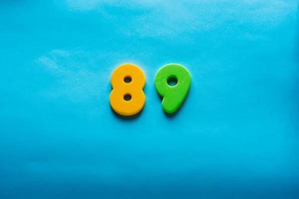 Number on a bright blue background. — Stock Photo, Image
