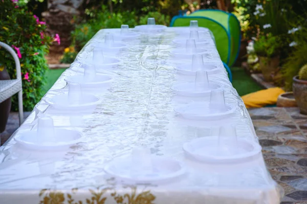 A table set for a party outdoors.