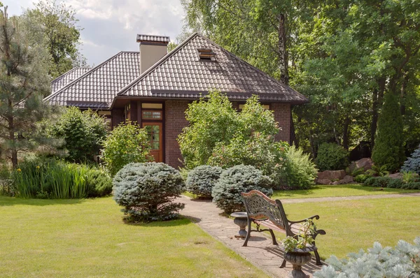 modern small villa with green park and trees