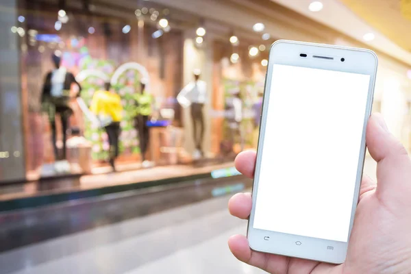 Los hombres usan imágenes borrosas de teléfonos inteligentes en el centro comercial como el backgroun — Foto de Stock