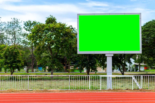 Digital blank scoreboard at football stadium with running track in sport stadium in outdoor ,Advertising Billboard LED, Empty green screen digital.