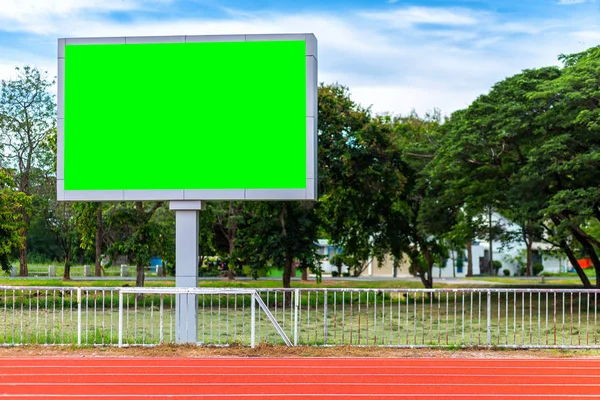 Digital blank scoreboard at football stadium with running track in sport stadium in outdoor ,Advertising Billboard LED, Empty green screen digital.