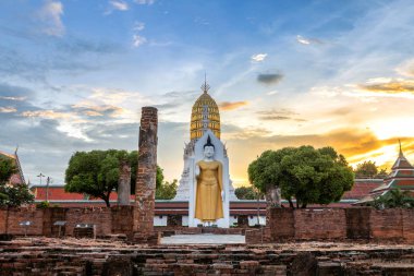 Buddha statue at sunset are Buddhist temple and major tourist attractions at Wat Phra Si Rattana Mahathat also colloquially referred to as Wat Yai is a Buddhist temple (wat) in Phitsanulok,Thailand. clipart