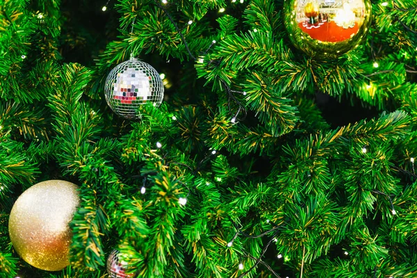 Closeup of Colorful balls on Green Christmas tree background Dec — Stock Photo, Image