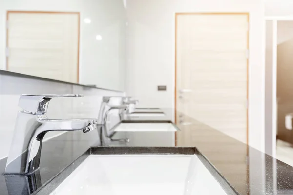 Public Interior of bathroom with sink basin faucet lined up Mode — Stock Photo, Image