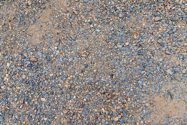 Sabbia colorata o consistenza di ciottoli. Struttura senza soluzione di continuità sul testo a terra — Foto Stock