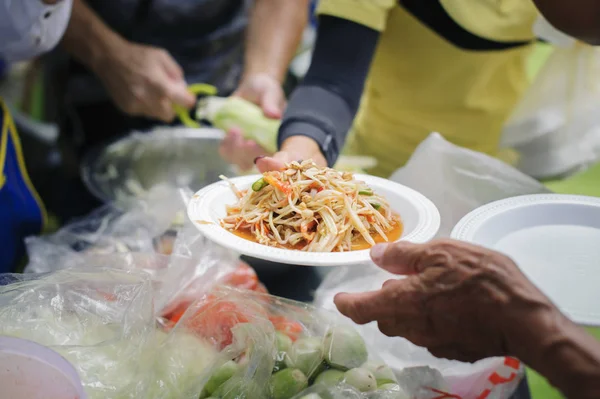 People outreach to donate food from volunteers : Food concept of hope : Free food for poor and homeless people donates food to food less people : Social concept of poor people sharing.