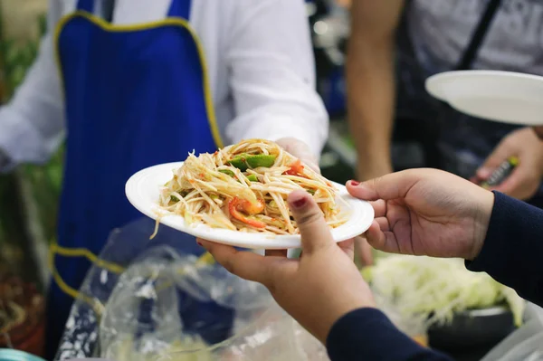 Concept serving free food to the poor : Free food, Using leftovers to feed the hungry : Food concept of hope : Food donation in the poor community of volunteers