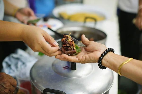 Volunteers Share Food to the Poor : Social Problems of Poverty Helped by Feeding : Concepts problems of life the poor