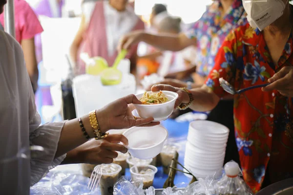 Volunteers Share Food to the Poor : Social Problems of Poverty Helped by Feeding : Concepts problems of life the poor