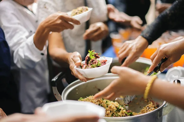 Food support: People are handing over food from volunteers with philanthropists to support cooking.