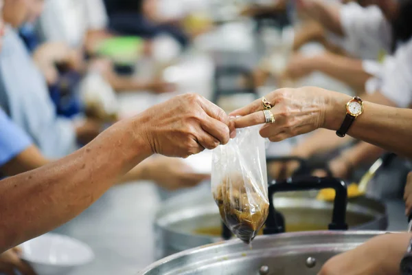 Sharing of food from volunteer hands to homeless people : The concept of feeding