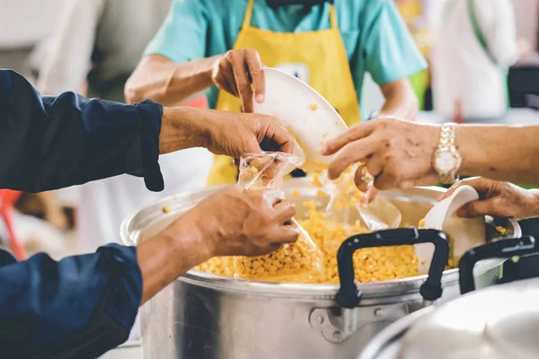 Philanthropists donate food and help the poor : concept of feeding