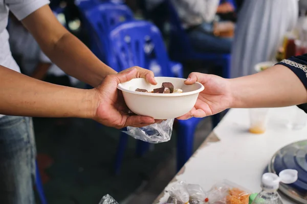 Donating food to the poor : People are experiencing a lot of poverty, Come and wait for free food