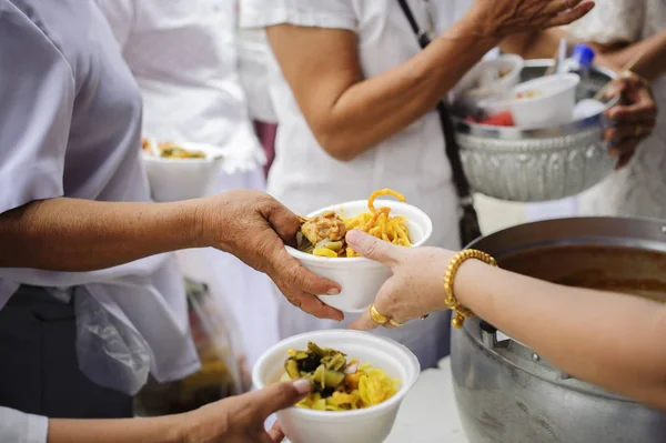 Food sharing in human societies can help homeless people : concept Sharing Food With Homeless