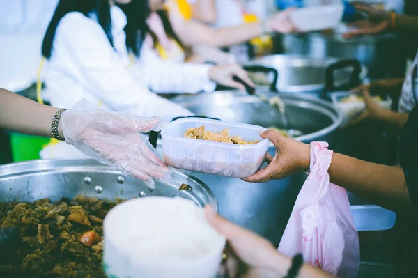 Charity food concept : Volunteers Share Food to the Poor to Relieve Hunger