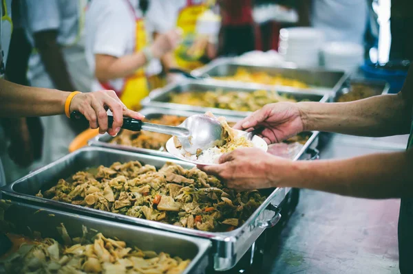 Charity food concept : Volunteers Share Food to the Poor to Relieve Hunger