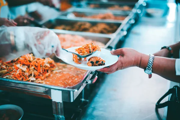 The concept of begging food : Hands of the poor are waiting for food donations to alleviate hunger