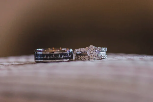 White gold wedding rings with diamonds on white pillow — Stock Photo, Image