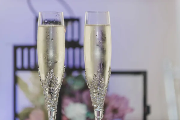 Bride and groom toasting wine glasses glasses
