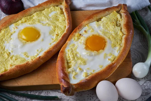 stock image Ajar traditional khachapuri. National Georgian cuisine. Khachapuri closeup.