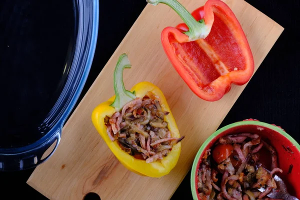 The process of cooking stuffed peppers. Pepper with eggplant, meat and tomato. Stuffed pepper