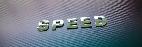 Snelheid chroom belettering op Carbon Fiber achtergrond — Stockfoto