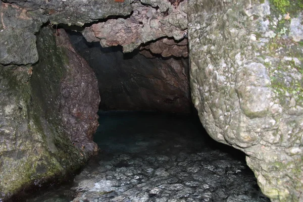 natural view with underground river between the rocks